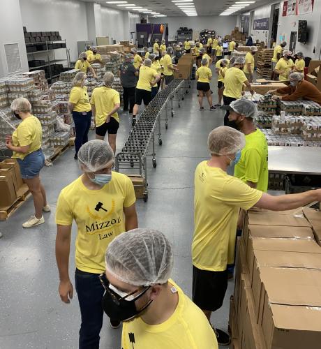 a group of students volunteering at the food bank