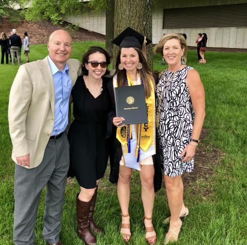 a photo of Mackenzie, her parents and her sister